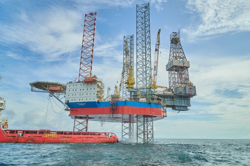 An offshore platform with a vessel next to it