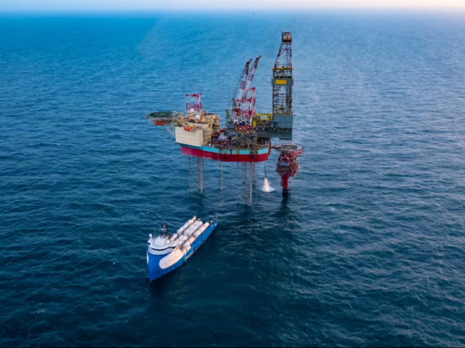 An offshore platform with a vessel next to it