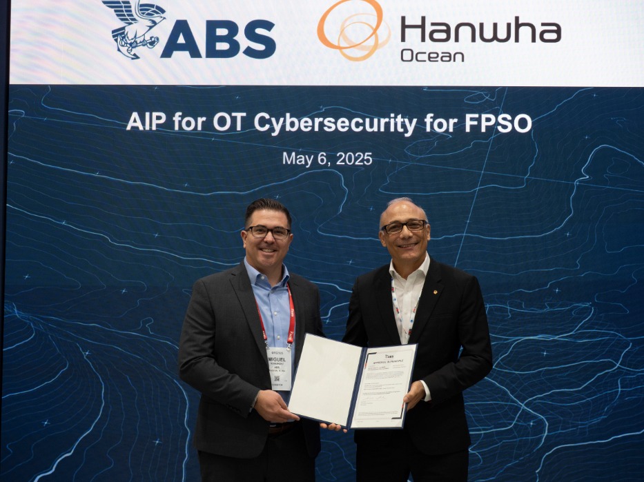Two men holding documents