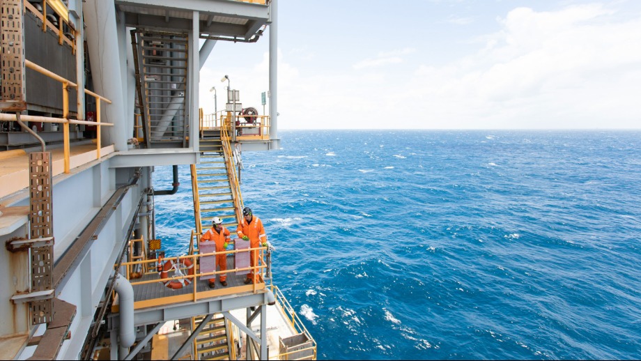 Two workers on an offshore platform